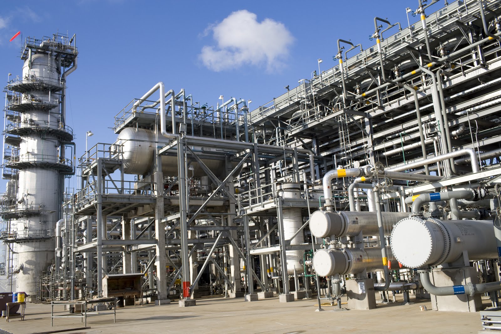 Large petrochemical refinery facility under blue sky